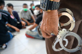 Hukuman Cambuk bagi Pelanggar Syariat Islam di Aceh