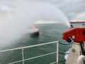 KN Pulau Dana-323 Bakamla RI Padamkan Kapal Terbakar
