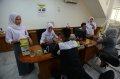 Sambut Hardiknas Karyawan Bank Bukopin Memakai Seragam Sekolah
