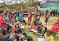 Satgas Yonif Mekanis 203/AK Ajak Anak Papua Belajar