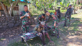 senyum-warga-sambut-satgas-pamtas-ri-png-yonif-raider-142kj_20220809_113155.jpg