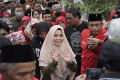 siti-atikoh-ganjar-ajak-masyarakat-gunakan-hak-pilih_20240124_232158.jpg