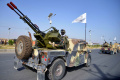 taliban-pamerkan-alutsista-peninggalan-as_20240816_075354.jpg