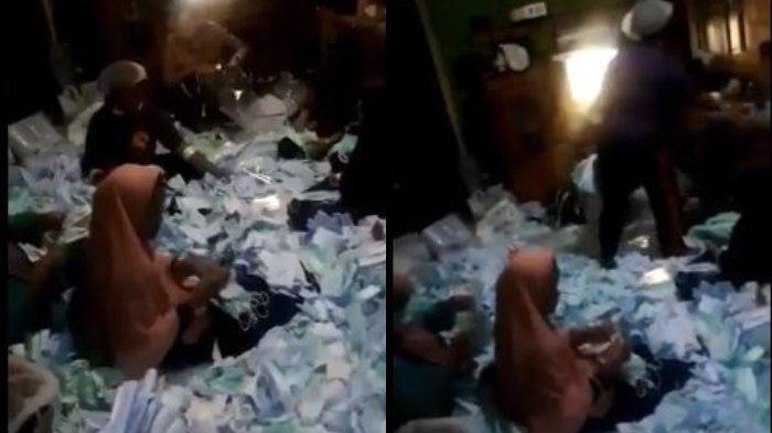 video viral yang beredar tampak sedang mengemas masker dengan duduk di atasnya