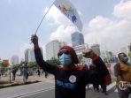 Aksi-unjuk-rasa-buruh-peringati-Hari-Buruh-Internasional-di-kawasan-Patung-Kuda-2021-2.jpg