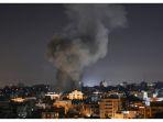 Asap-terlihat-di-atas-gedung-gedung-di-Kota-Gaza.jpg