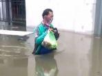ojol-antar-makanan-di-tengah-banjir-dapat-penghargaan.jpg