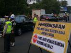 pemeriksaan-kendaraan-yang-melintas-di-pintu-tol-jagorawi.jpg