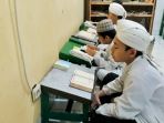 20170606begini-cara-santri-di-ponpes-tahfidz-menghafal-al-quran-hingga-30-juz_20170606_174943.jpg