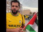 Suporter-Brazil-bawa-bendera-Palestina-di-Piala-Dunia-2022.jpg