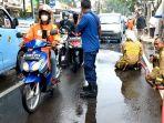 Tumpahan-solar-di-Jalan-M-Kahfi-depan-RSUD-Jagakarsa.jpg