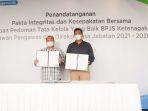 jajaran-direksi-dan-dewas-bpjamsostek-melakukan-penandaranganan-pakta-integritas.jpg