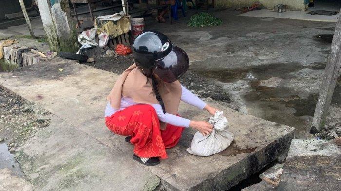 cuplikan-seorang-ibu-melihat-potongan-tubuh-kucing-medan.jpg
